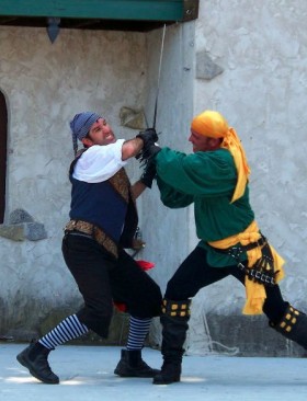 Image of two people swordfighting